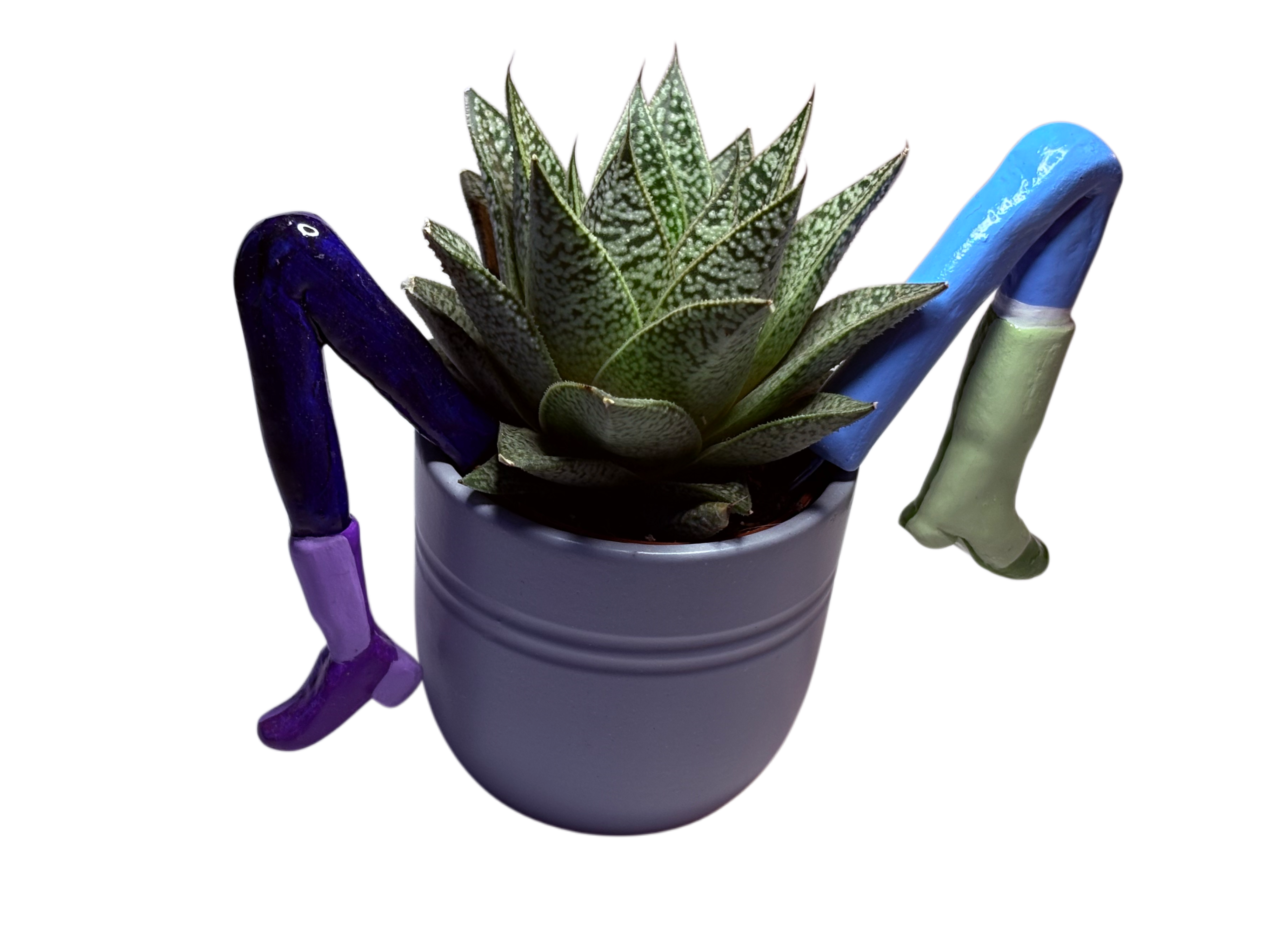 A sculptural clay piece — plant pot with hand-shaped arms